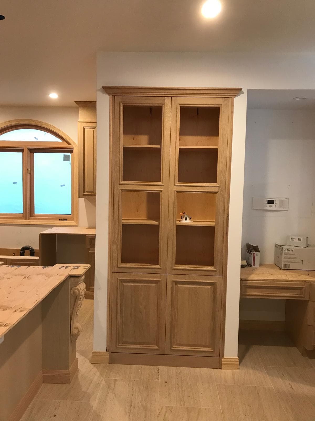 Close-up of custom wood cabinet grain and handle alignment